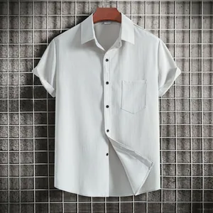 Macro view showing fabric texture of white men's casual short sleeve shirt with chest pocket