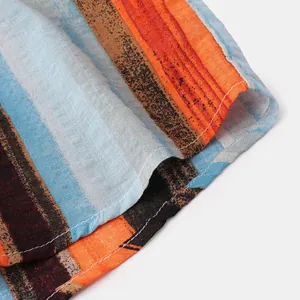 Macro detail showing vertical stripes and neat stitching on a men's summer cotton linen shirt