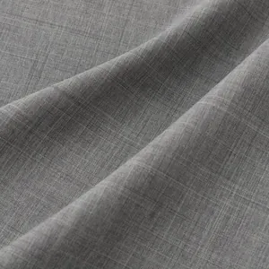 Detalle macro de la textura de tela gris transpirable para camisa de verano de hombre