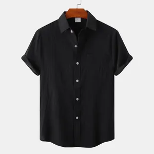 Front view of a minimalist black men's short-sleeved cotton linen button-down shirt