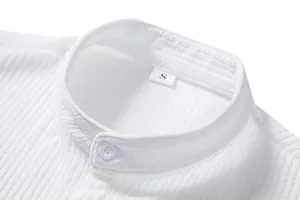Detail shot of white band collar shirt showing textured fabric and size label.