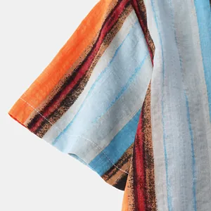 Close-up detail of a men's linen-cotton short sleeve shirt with vibrant vertical stripes