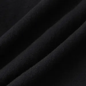 Close-up of high-quality black cotton linen fabric showing breathable texture
