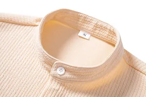 Macro detail of men's waffle texture shirt with elegant mandarin collar