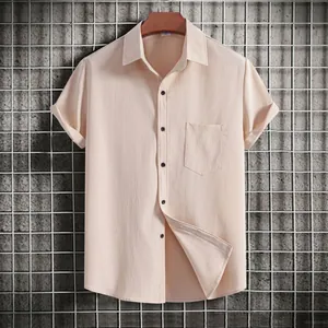 Detail of men's apricot casual short-sleeved shirt with textured fabric and pocket.