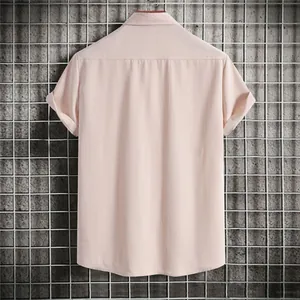 Back view of men's pink casual short-sleeved shirt with textured fabric and lapel collar