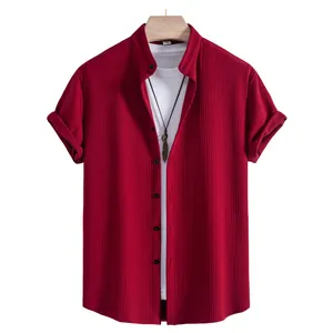 Close-up view of a burgundy ribbed men's short sleeve shirt featuring button-down design