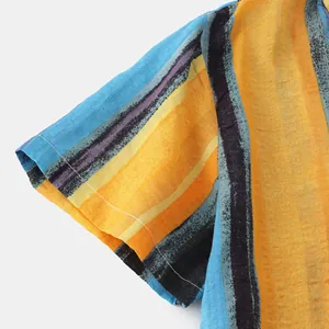 Close-up detail of the cotton-linen fabric texture and colorful striped print on the sleeve