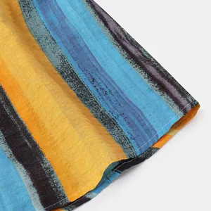 Close-up of colorful striped cotton linen shirt fabric showing texture and stitching