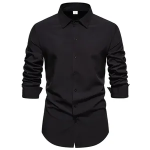 Detail view of a men's classic long-sleeved casual black shirt with button-down front.