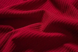 Detailed close-up of the red ribbed knit fabric used for the men's casual summer shirt.