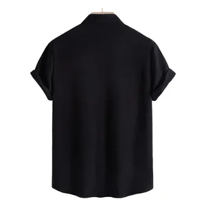 Detailed back view of men's black short-sleeved casual shirt with textured ribbed fabric