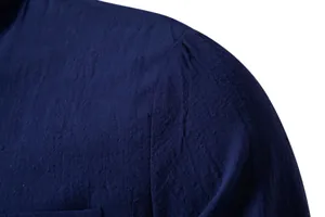 Detailed macro view of high-quality textured cotton linen fabric on navy blue men's shirt