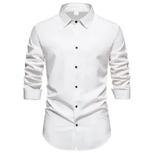 Detail view showing front of men's casual solid white long sleeve shirt with black buttons