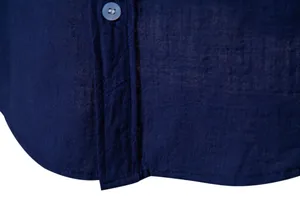 Close-up detail of navy blue cotton linen shirt showing fabric texture and hem finish