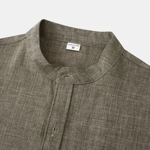 Detailed view of the stand collar and linen fabric texture on a men's casual shirt