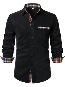 Dettaglio camicia da uomo in velluto nero con fodera scozzese a contrasto su collo