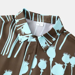 Gros plan sur le col et l'étiquette de taille M d'une chemise à fleurs pour hommes