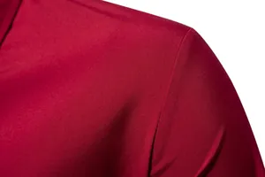 Macro close-up detail of the red fabric texture and shoulder seam on a men's shirt