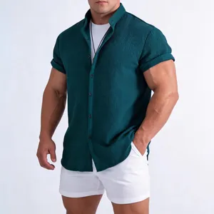 Professional studio shot of a dark green textured short sleeve casual shirt for men