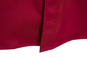 Close-up of wine red men's shirt fabric showing detailed hem and double stitching work