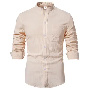 Detail of a men's cotton linen long-sleeved shirt in apricot with a chest pocket