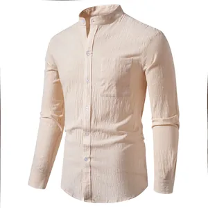 Close-up of men's linen long sleeve shirt with stand collar and chest pocket in beige