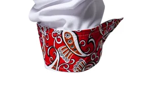 Close-up detail of white long sleeve shirt cuff featuring red paisley pattern lining