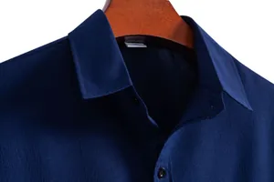 Close-up of navy blue men's casual shirt collar showing high-quality fabric texture
