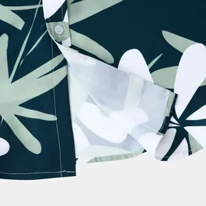 Vue rapprochée du motif de feuilles tropicales et des coutures sur l'ourlet de chemise
