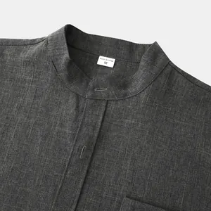 Detailed view of dark grey mandarin collar cotton linen shirt neckline showing texture