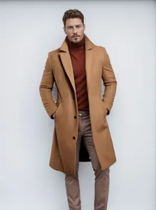 Elegant men's camel wool overcoat styled with a brown turtleneck and tailored pants