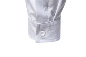 Close-up detail of a white buttoned cuff on a men's long-sleeve casual shirt