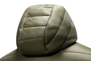 Macro view showcasing the stitching and texture of the olive green hooded puffer jacket