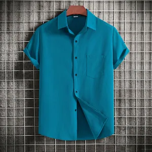 Macro view of turquoise men's short-sleeved shirt with linen texture