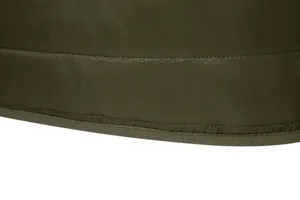 Detailed view of the neat stitching and hem of an olive green men's quilted winter jacket.