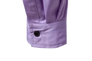 Close-up of a lavender men's long sleeve shirt cuff with a classic black button detail