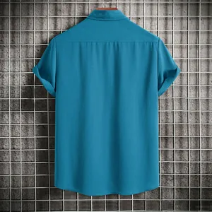 Back view of a men's solid blue short-sleeved casual shirt with textured fabric detail