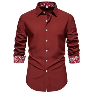 Detailed front view of a burgundy men's long-sleeve shirt featuring paisley print cuffs