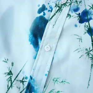 Détail macro du bouton blanc et de l'imprimé bambou sur une chemise hawaïenne pour homme