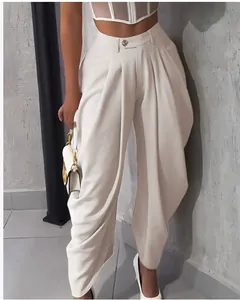 Detailed macro view of white high-waisted tulip pleated wide-leg casual pants for women