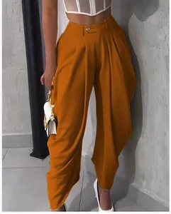 Chic burnt orange high-waisted pleated barrel pants for a trendy urban casual look