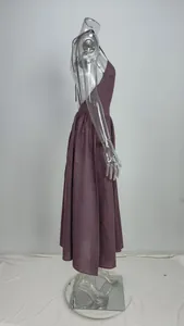 Side view of elegant purple backless halter maxi dress displayed on a clear mannequin