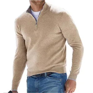 Detailed view of a men's camel quarter-zip cashmere sweater with ribbed knit cuffs.
