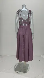 Detailed back view of an elegant plum purple backless midi dress with adjustable tie straps
