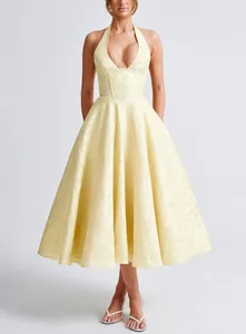 Elegant pale yellow halter V-neck jacquard midi dress with backless detail and flared skirt