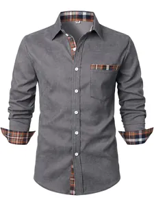 Primo piano di camicia in velluto a coste grigio da uomo con dettagli scozzesi a contrasto.
