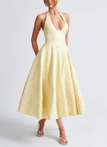 Elegant light yellow halter neck jacquard midi dress with deep V-neck and flared skirt