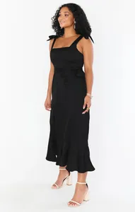 Elegant black French style sleeveless midi dress with shoulder ties and ruffled hem
