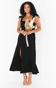 Elegant black French split midi dress with tie-shoulder straps and ruffled hem